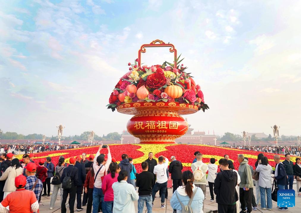 This photo taken on Sept. 25, 2024 shows a flower basket at Tian'anmen Square in Beijing, capital of China. The 18-meter-tall display in the shape of a flower basket is placed at Tian'anmen Square as a decoration for the upcoming National Day holiday. (Photo: Xinhua)