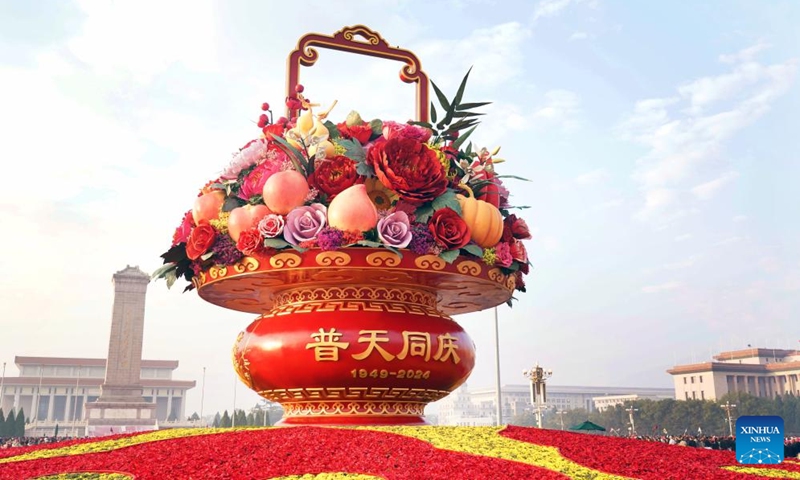 This photo taken on Sept. 25, 2024 shows a flower basket at Tian'anmen Square in Beijing, capital of China. The 18-meter-tall display in the shape of a flower basket is placed at Tian'anmen Square as a decoration for the upcoming National Day holiday. (Photo: Xinhua)