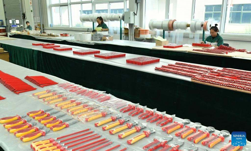 Workers assemble products at a company producing explosion-preventive tools in Botou, north China's Hebei Province, Sept. 24, 2024. As one of the old industry bases in the central south of Hebei, Botou is dubbed origin of casting industry in the country, home to 322 casting companies, and boasting an annual output of 24.7 billion yuan (about 3.52 billion U.S. dollars) by clustered players there. Recent years have witnessed their manufacturing processes converted to green and environmental friendly ones. (Photo: Xinhua)