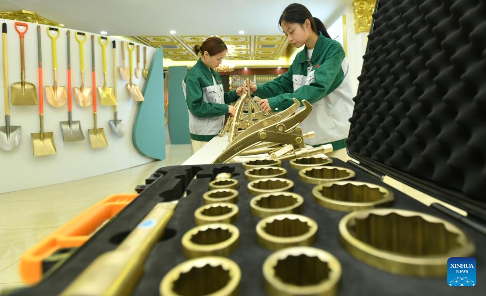 Workers arrange exhibits at the exhibition hall of a company producing explosion-preventive tools in Botou, north China's Hebei Province, Sept. 24, 2024. As one of the old industry bases in the central south of Hebei, Botou is dubbed origin of casting industry in the country, home to 322 casting companies, and boasting an annual output of 24.7 billion yuan (about 3.52 billion U.S. dollars) by clustered players there. (Photo: Xinhua)