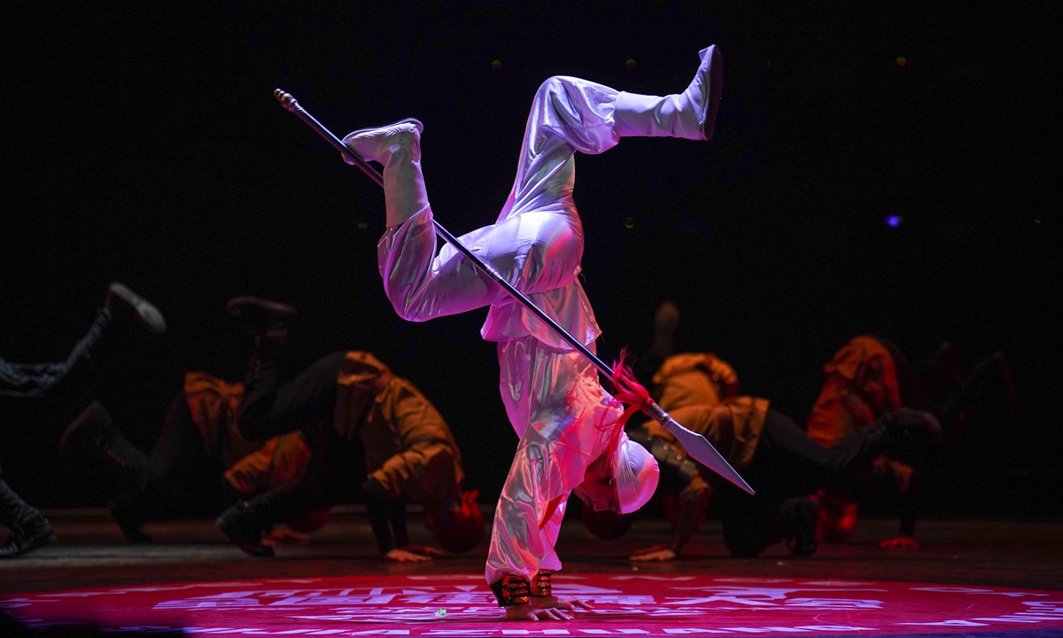 Breaking dancer Tu Baihua in traditional costume performs with a spear   Photo: Courtesy of Tu Baihua