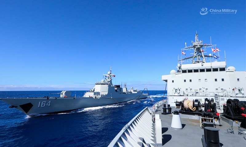 Comprehensive supply ship Luomahu (Hull 964) attached to a navy flotilla under the PLA Southern Theater Command provides liquid supply to Type 052D guided-missile destroyer Guilin (Hull 164) via alongside replenishment-at-sea during a comprehensive logistic exercise on August 6, 2024. (eng.chinamil.com.cn/Photo by Li Junlin)  