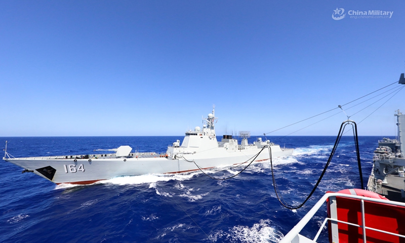 Comprehensive supply ship Luomahu (Hull 964) attached to a navy flotilla under the PLA Southern Theater Command provides liquid supply to Type 052D guided-missile destroyer Guilin (Hull 164) via alongside replenishment-at-sea during a comprehensive logistic exercise on August 6, 2024. (eng.chinamil.com.cn/Photo by Li Junlin)  