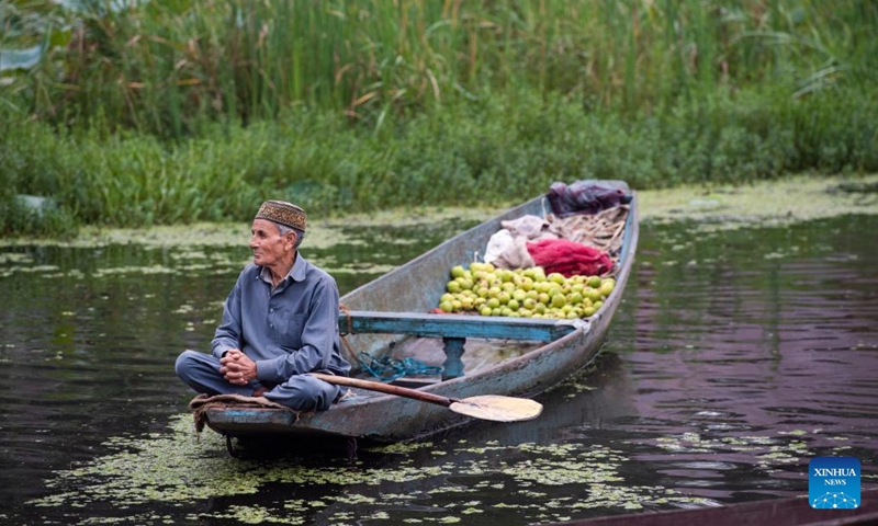 A man selling fruits waits for customers at Dal lake in Srinagar, the summer capital of Indian-controlled Kashmir, Sept. 27, 2024. (Photo: Xinhua)