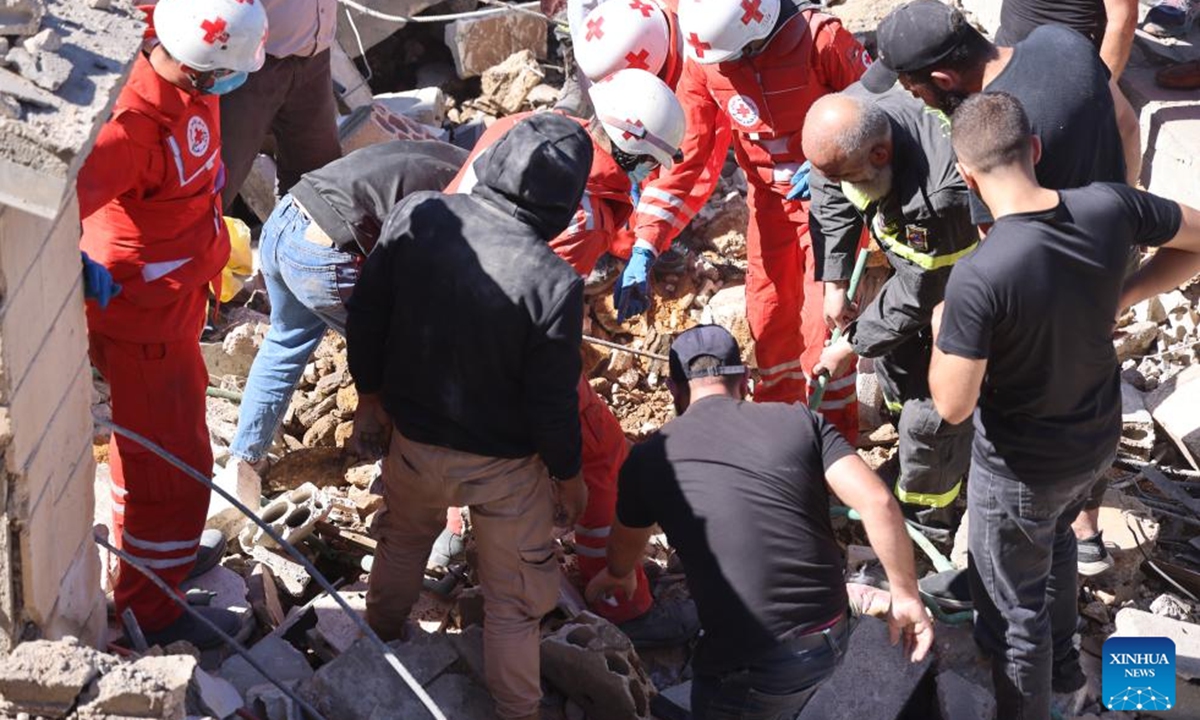 People search among the rubble after an Israeli airstrike in Shebaa, Lebanon, on Sept. 27, 2024. Nine people were killed early Friday in an Israeli airstrike on the southeastern Lebanese town of Shebaa, the Lebanese Health Ministry said. (Photo: Xinhua)