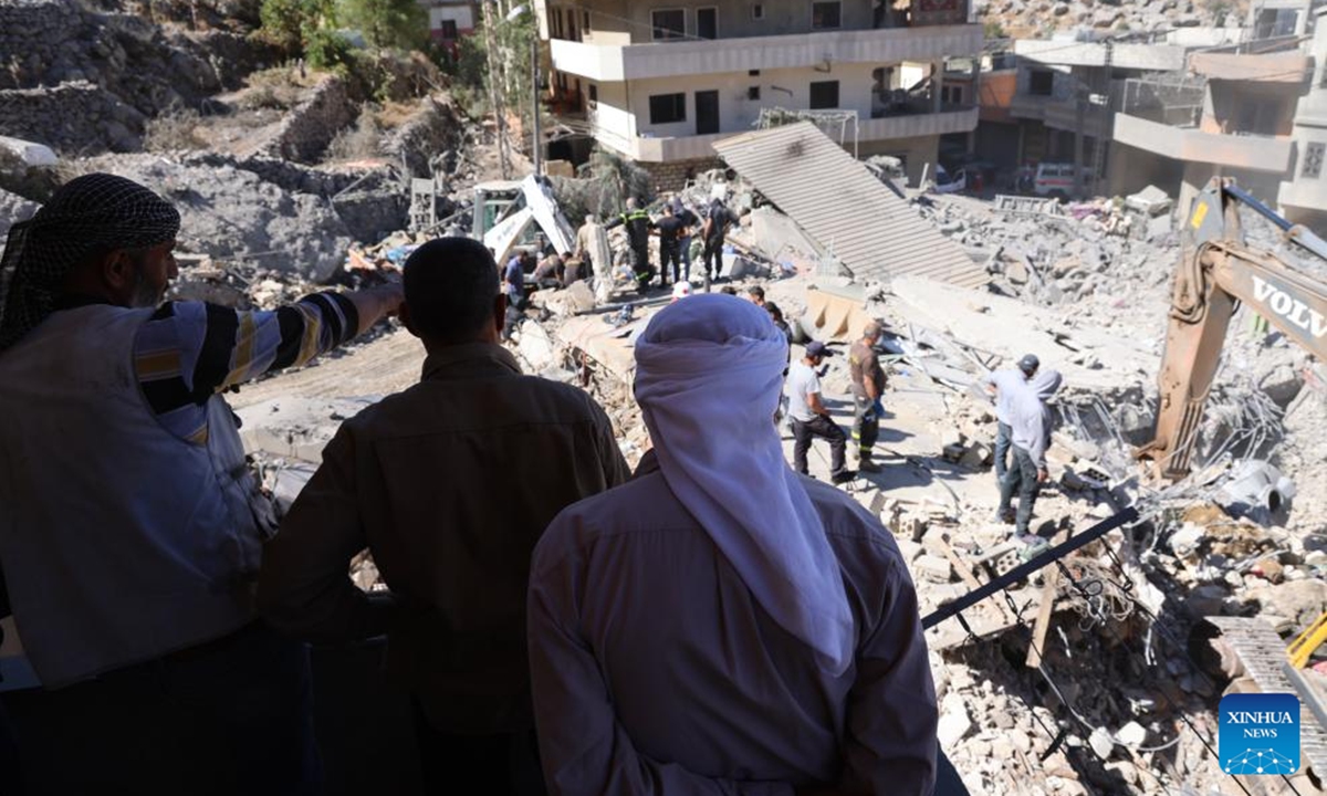 People search among the rubble after an Israeli airstrike in Shebaa, Lebanon, on Sept. 27, 2024. Nine people were killed early Friday in an Israeli airstrike on the southeastern Lebanese town of Shebaa, the Lebanese Health Ministry said. (Photo: Xinhua)