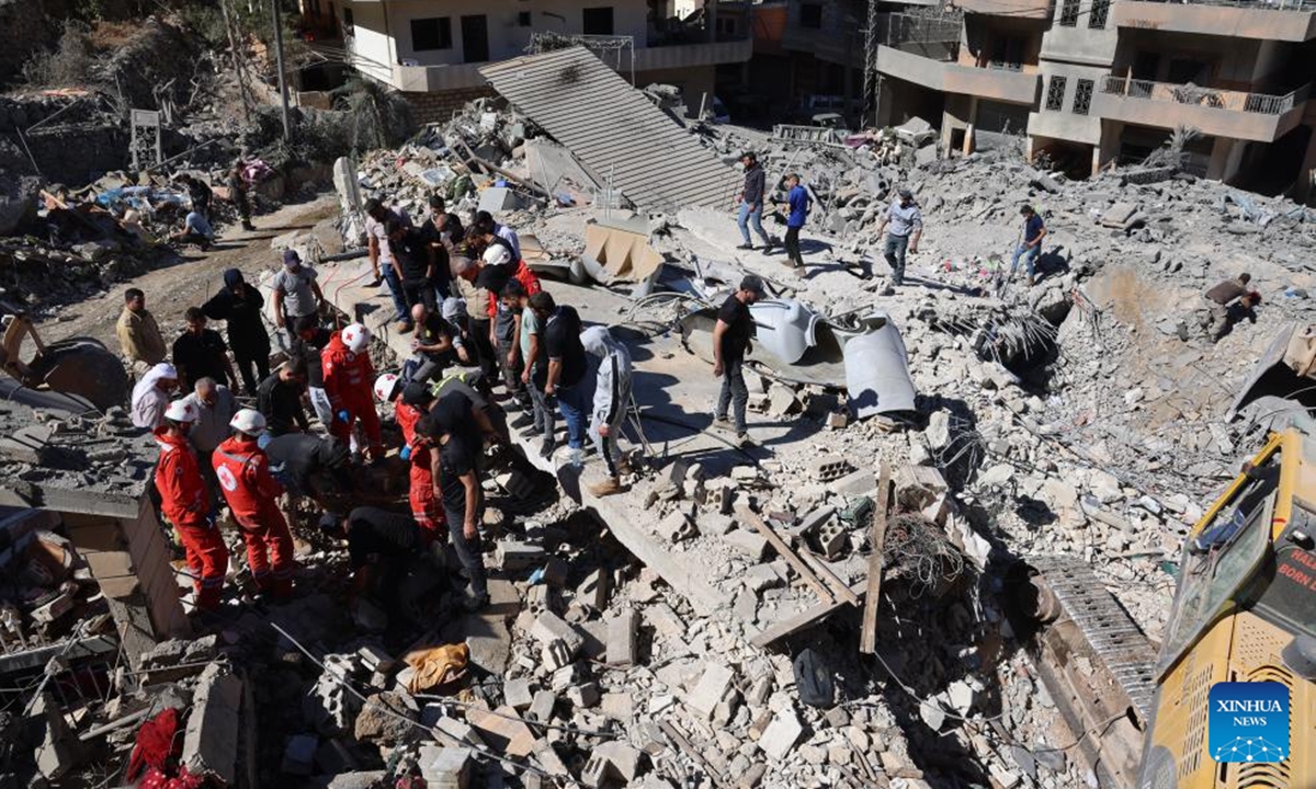 People search among the rubble after an Israeli airstrike in Shebaa, Lebanon, on Sept. 27, 2024. Nine people were killed early Friday in an Israeli airstrike on the southeastern Lebanese town of Shebaa, the Lebanese Health Ministry said. (Photo: Xinhua)