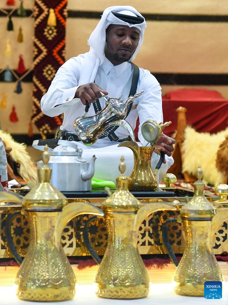 A man prepares Arabic coffee during the 2nd edition of Doha International Coffee Exhibition 2024 in Doha, Qatar, Sept. 27, 2024. The event is held here from Sept. 26 to 28.  (Photo: Xinhua)