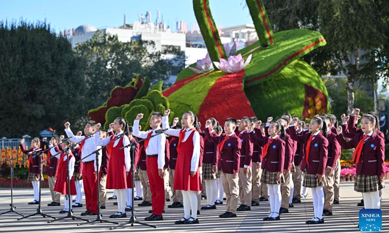 Members of the Chinese Young Pioneers deliver a speech during a flag-raising ceremony held to mark the 75th anniversary of the founding of the People's Republic of China at the People's Square in Urumqi of northwest China's Xinjiang Uygur Autonomous Region on Oct. 1, 2024. (Photo: Xinhua)