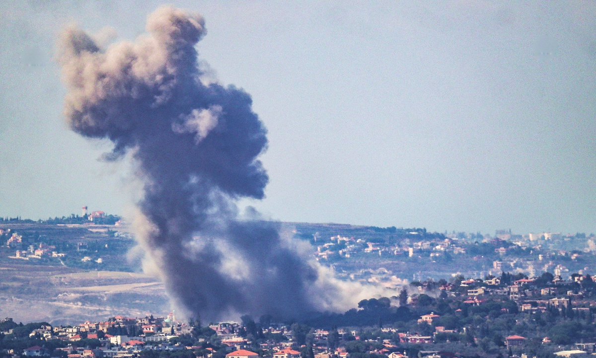 Smoke rises from the site of an Israeli airstrike that targeted the southern Lebanese border village of Zawtar on September 29, 2024. Israel said on September 29 that it was carrying out new air raids against 