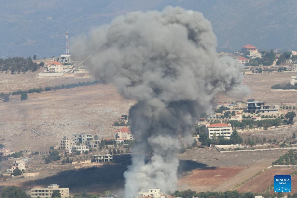 This photo taken on Sept. 28, 2024 shows smoke rising following an Israeli airstrike in Khiam, Lebanon. Israeli warplanes launched a series of air raids on Hezbollah sites and towns and villages in southern and eastern Lebanon early Saturday morning, said Lebanese military sources. (Photo: Xinhua)