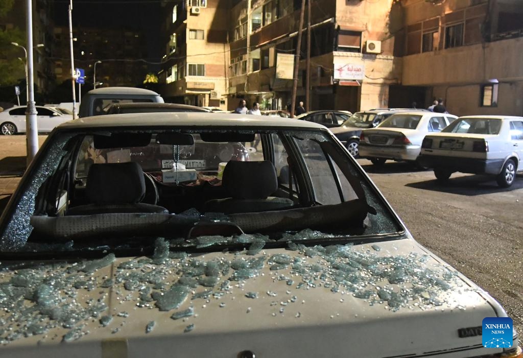 A damaged car is seen as a result of an Israeli aerial assault in the Mazzeh Villas area west of Damascus, Syria, Oct. 1, 2024. According to the Syrian Defense Ministry, the attack have resulted in the deaths of three civilians and injuries to nine others. (Photo: Xinhua)