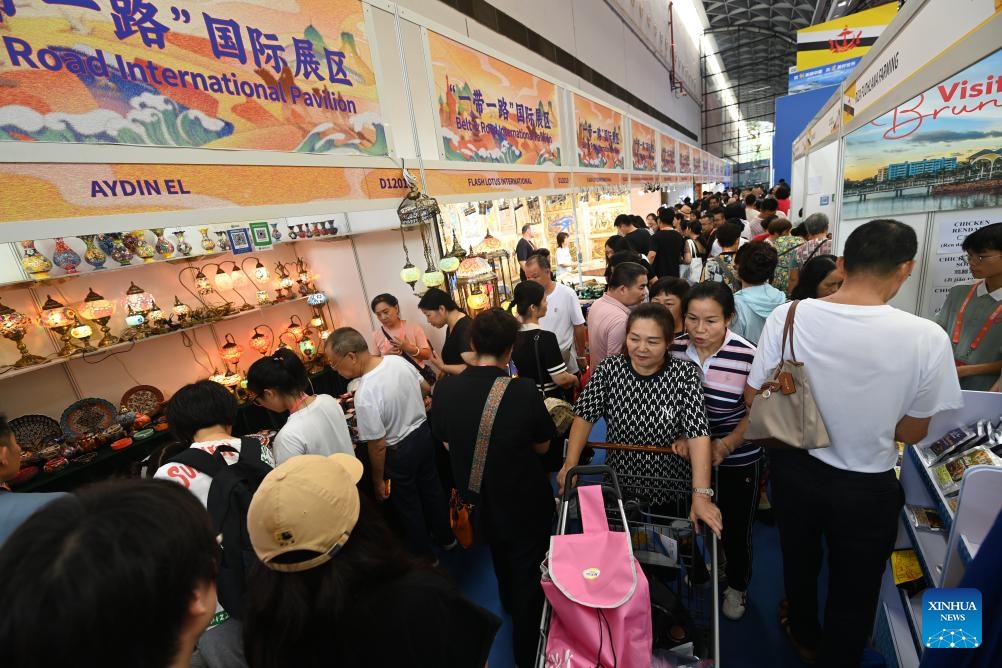 Visitors buy products at the Belt and Road International Pavilion during the 21st China-ASEAN Expo at Nanning International Convention and Exhibition Center in Nanning, south China's Guangxi Zhuang Autonomous Region, Sept. 28, 2024. Products from the Association of Southeast Asian Nations (ASEAN) countries, such as durians, cookies and rosewood, as well as those from other countries including Russian sausages and Peruvian alpaca-fur stuffed toys have enjoyed popularity at the 21st China-ASEAN Expo in Nanning. (Photo: Xinhua)