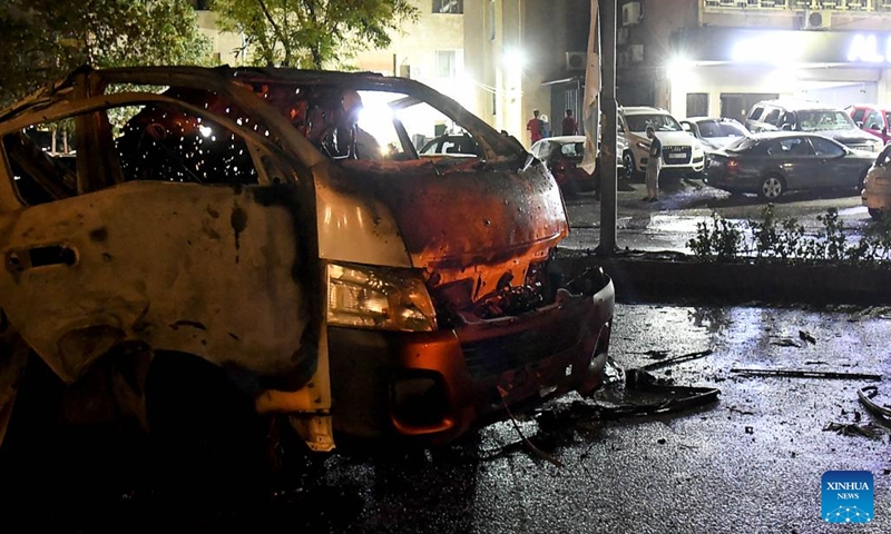 A damaged car is seen as a result of an Israeli aerial assault in the Mazzeh Villas area west of Damascus, Syria, Oct. 1, 2024. According to the Syrian Defense Ministry, the attack have resulted in the deaths of three civilians and injuries to nine others. (Photo: Xinhua)