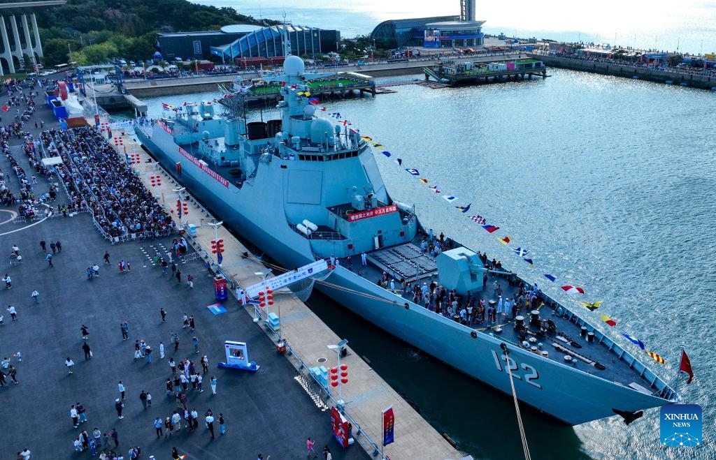 An aerial drone photo shows visitors on the naval vessel Tangshan during an open day activity at a port in Qingdao of east China's Shandong Province, Oct. 1, 2024. (Photo: Xinhua)