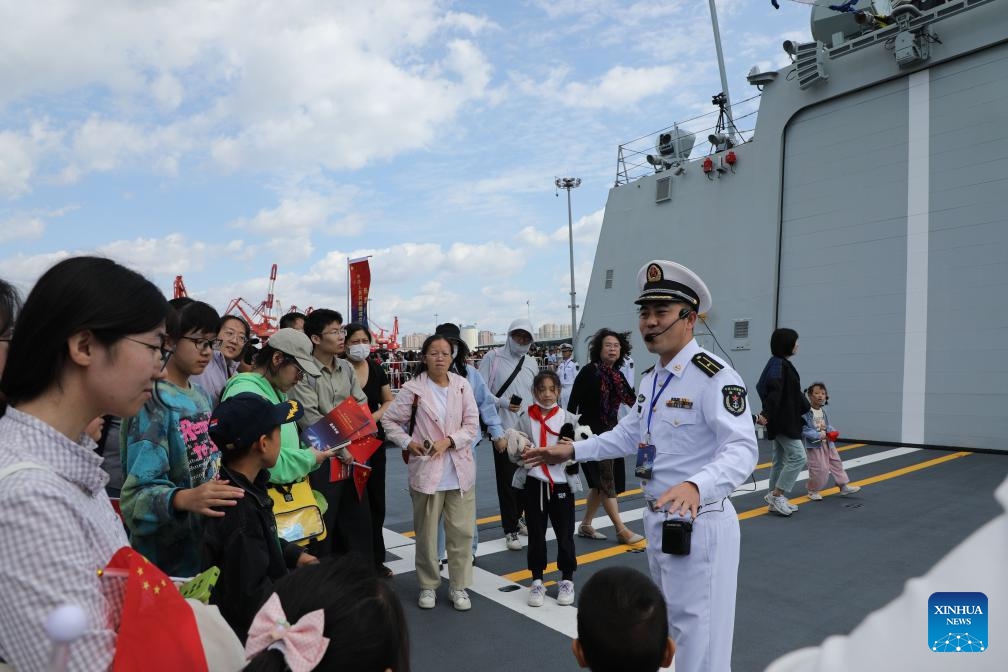 A naval soldier guides visitors in a tour on board a military vessel during an open day activity in Qingdao of east China's Shandong, Oct. 1, 2024. (Photo: Xinhua)