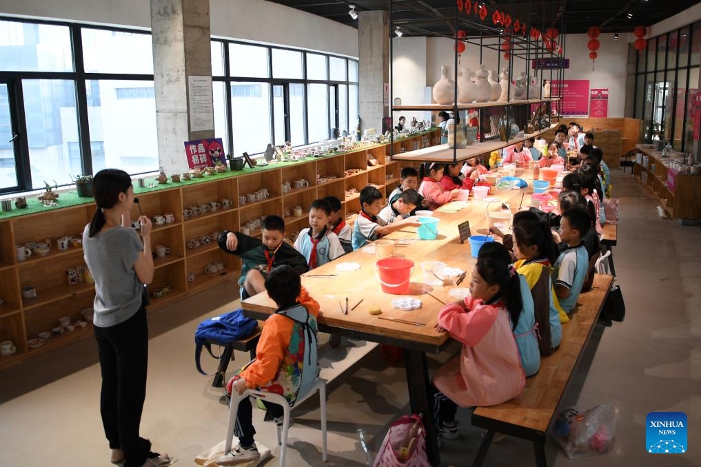 Children take part in a ceramics making course in Liling City, central China's Hunan Province, Sept. 27, 2024. Liling of Hunan Province boasts a long history of ceramic production. The city now has more than 650 ceramic production enterprises and nearly 200,000 related employees. In recent years, local ceramic production enterprises have intensified their efforts to improve the making techniques. Some of them have also organized ceramics making experience activities and low-price shopping areas to attract tourists. (Photo: Xinhua)