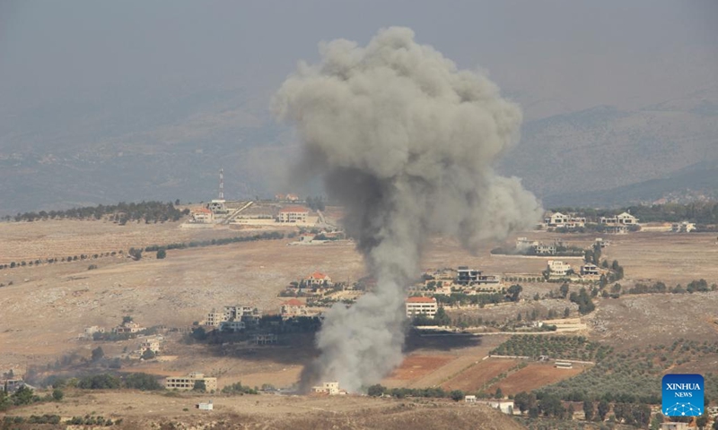 This photo taken on Sept. 28, 2024 shows smoke rising following an Israeli airstrike in Khiam, Lebanon. Israeli warplanes launched a series of air raids on Hezbollah sites and towns and villages in southern and eastern Lebanon early Saturday morning, said Lebanese military sources. (Photo: Xinhua)