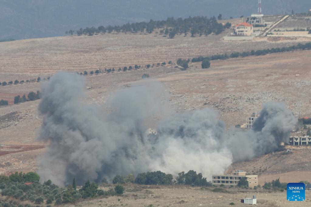 This photo taken on Sept. 28, 2024 shows smoke rising following an Israeli airstrike in Khiam, Lebanon. Israeli warplanes launched a series of air raids on Hezbollah sites and towns and villages in southern and eastern Lebanon early Saturday morning, said Lebanese military sources. (Photo: Xinhua)