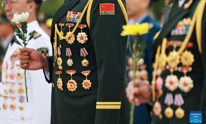 A ceremony presenting flower baskets to fallen heroes to mark Martyrs' Day is held at Tian'anmen Square in Beijing, capital of China, Sept. 30, 2024. (Photo: Xinhua)