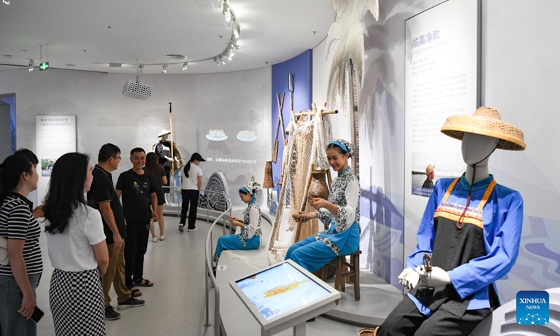 People visit the Hainan Intangible Cultural Heritage Exhibition Center in Haikou, south China's Hainan Province, Sept. 30, 2024. The exhibition center, one of the provincial capital's major public cultural projects, began trial operation on Monday and will last for one month. (Photo: Xinhua)