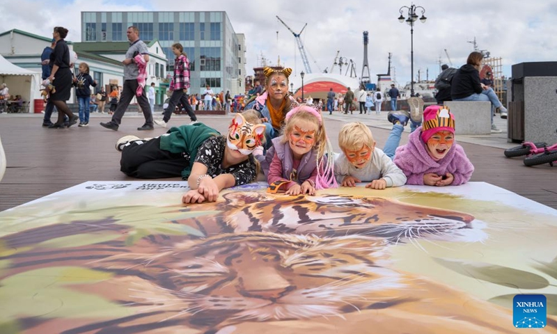 Children complete a tiger puzzle during the Tiger Day event in Vladivostok, Russia, Sept. 29, 2024. Since the year 2000, the last Sunday of September has been the Tiger Day in Russia. On Sunday, the city of Vladivostok hosted a variety of colorful events to promote awareness of protecting tigers and other wild animals. Photo: Xinhua