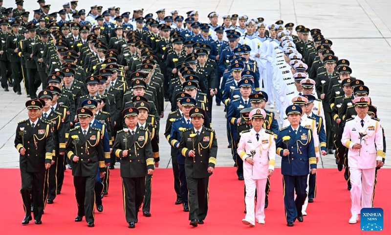 A ceremony presenting flower baskets to fallen heroes to mark Martyrs' Day is held at Tian'anmen Square in Beijing, capital of China, Sept. 30, 2024. (Photo: Xinhua)