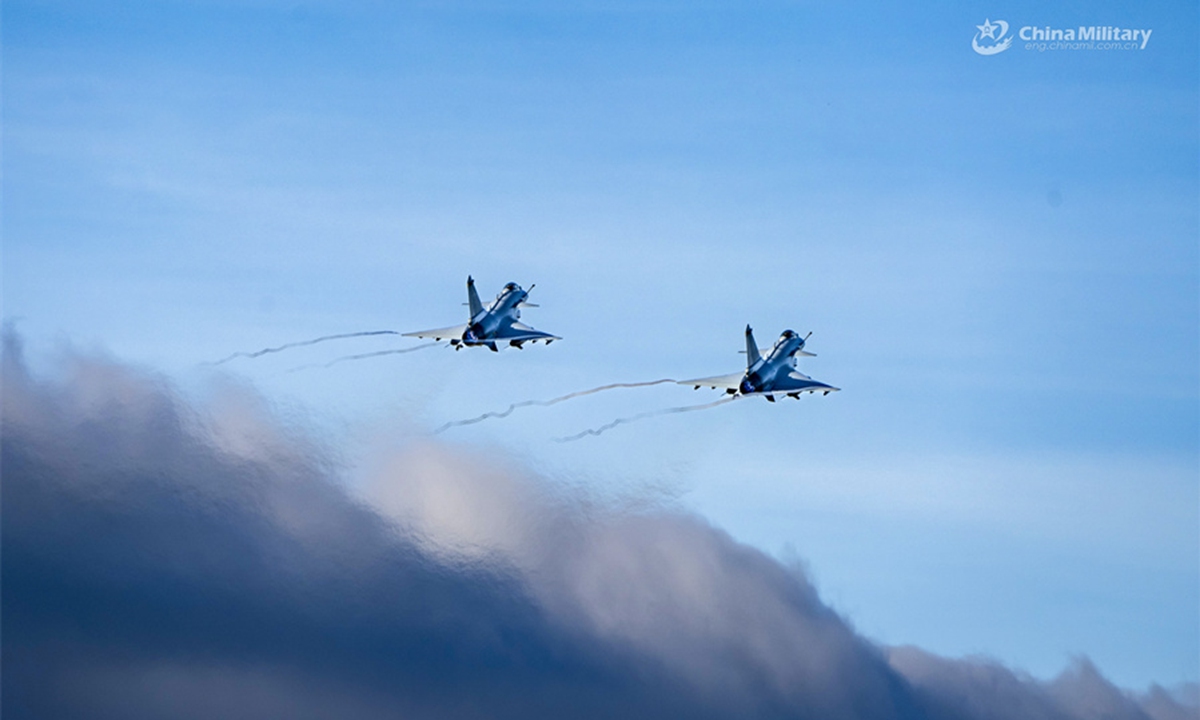 Fighter jets attached to an aviation brigade under the Chinese PLA Air Force soar in the sky during a flight training exercise in late July, 2024. (eng.chinamil.com.cn/Photo by Hou Kaiwen)