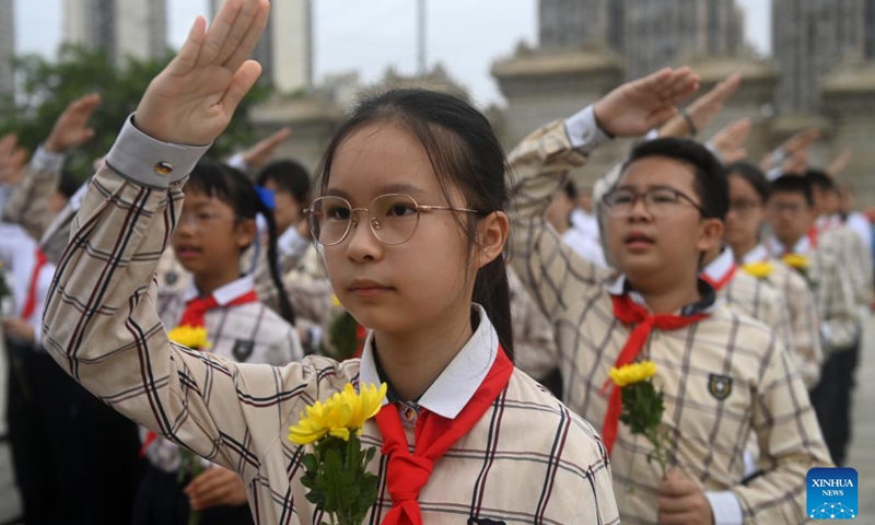 Members of the Chinese Young Pioneers salute during a mourning ritual at a martyrs' cemetery in Nanning, south China's Guangxi Zhuang Autonomous Region, Sept. 30, 2024. (Photo: Xinhua)