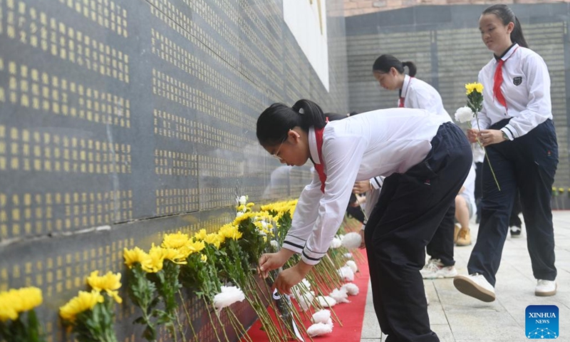 Members of the Chinese Young Pioneers lay flowers to pay tribute to fallen heroes at a martyrs' cemetery in Nanning, south China's Guangxi Zhuang Autonomous Region, Sept. 30, 2024. (Photo: Xinhua)