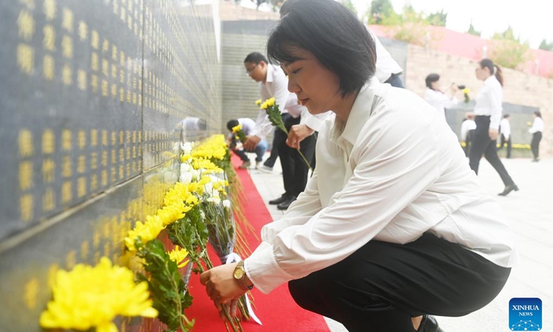 People lay flowers to pay tribute to fallen heroes at a martyrs' cemetery in Nanning, south China's Guangxi Zhuang Autonomous Region, Sept. 30, 2024. (Photo: Xinhua)