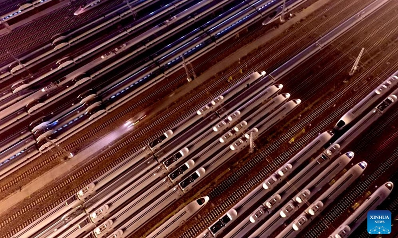 An aerial drone photo shows bullet trains at a train depot in Zhengzhou, central China's Henan Province, Sept. 6, 2016. Strategically positioned in central part of the country, Henan has been serving as a national hub of transporation for ages. The past decades saw the province building a modern transportation network consisting air flights, railways, highways, water channels and all sorts of ports. It is now rapidly extending its role to areas of cross-border logistics, investment, and trade to facilitate the dual circulation of domestic and international markets. Photo: Xinhua