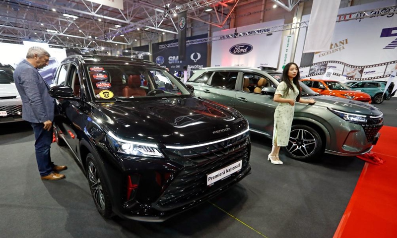 A visitor views a Fengon 600 SUV from Chinese automaker Dongfeng Sokon during the first day of Bucharest Auto Show & Accessories (SAB) in Bucharest, Romania, Oct. 1, 2024. Dozens of conventional, hybrid and electric vehicles, and over 600 brands from the fields of equipment, self-service car washes, parts, accessories, and services are on display at the exhibition until Oct. 6. (Photo by Cristian Cristel/Xinhua)