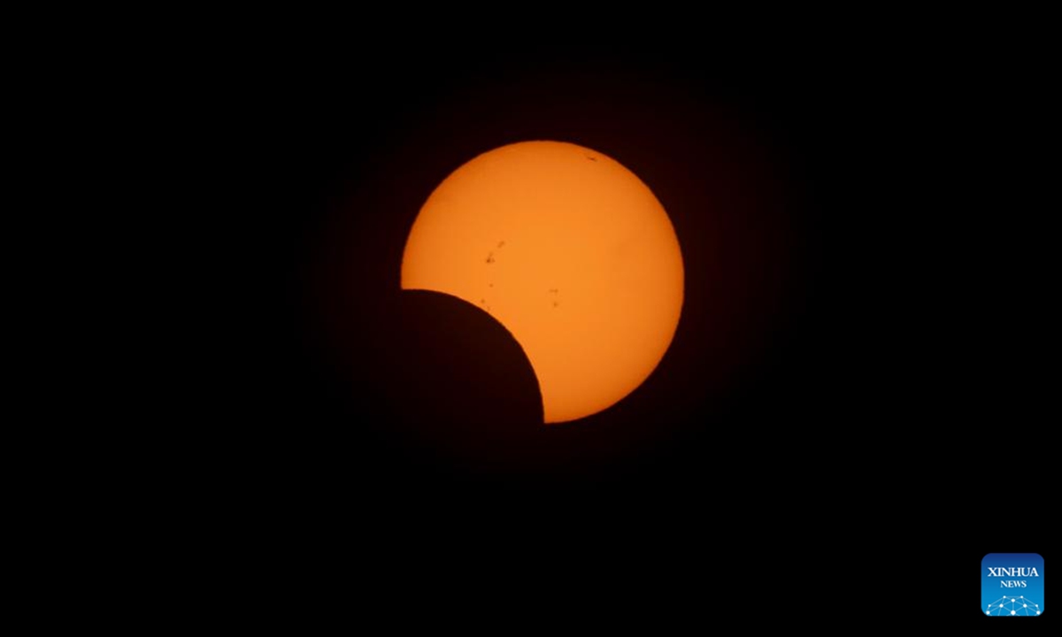 A solar eclipse appears over Buenos Aires, capital of Argentina on Oct. 2, 2024. (Photo by Martin Zabala/Xinhua)