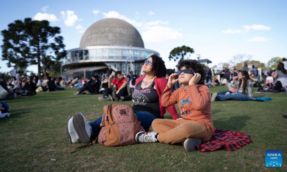 People observe an annular solar eclipse in Buenos Aires, capital of Argentina, on Oct. 2, 2024. (Photo by Martin Zabala/Xinhua)