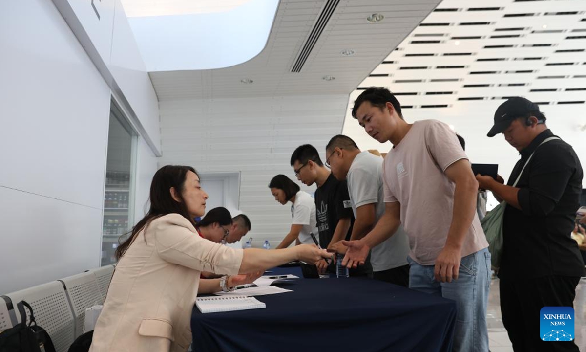 Chinese citizens evacuated from Lebanon line up for procedures at the Port of Limassol, Cyprus, on Oct. 1, 2024. (Xinhua/Li Jing)