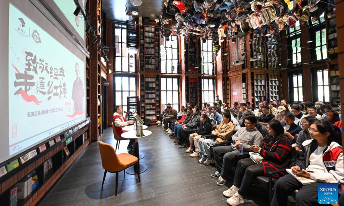 Readers attend a book-reading session at Zhongshuge Bookstore in the Italian Style Area in Tianjin, north China, Oct. 2, 2024. Zhongshuge Bookstore, an urban renewal and upgrading project of Tianjin, attracts many tourists during the National Day holiday. It will serve citizens with various cultural activities to promote reading in the future. (Xinhua/Sun Fanyue)