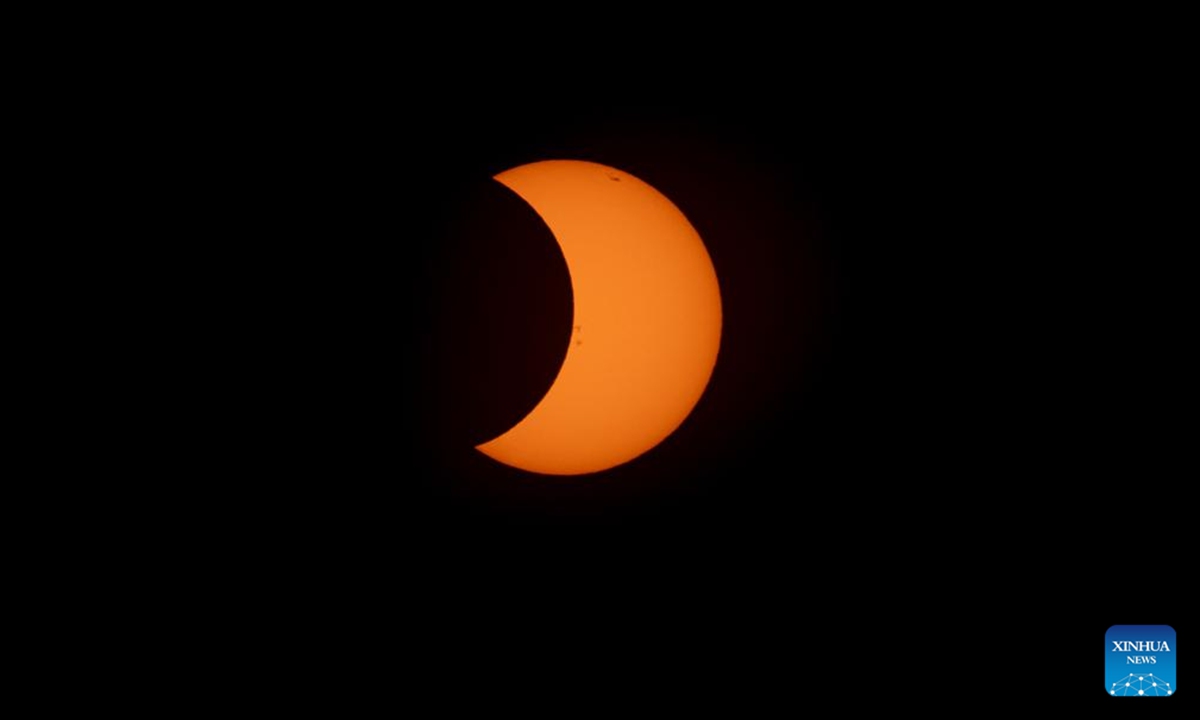 A solar eclipse appears over Buenos Aires, capital of Argentina on Oct. 2, 2024. (Photo by Martin Zabala/Xinhua)