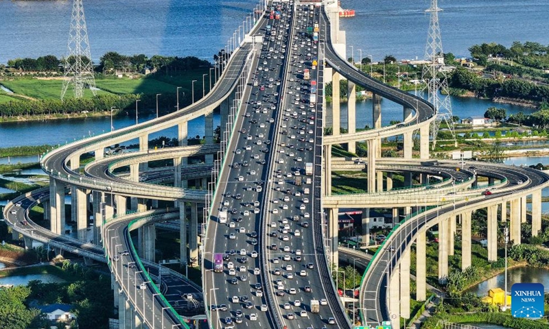 An aerial drone photo taken on Oct. 2, 2024 shows a view of an interchange overpass on the Nansha Bridge, which links Guangzhou City and Dongguan City, in Haiou Island of the Pearl River Estuary area in Guangzhou, south China's Guangdong Province. (Xinhua/Liu Dawei)