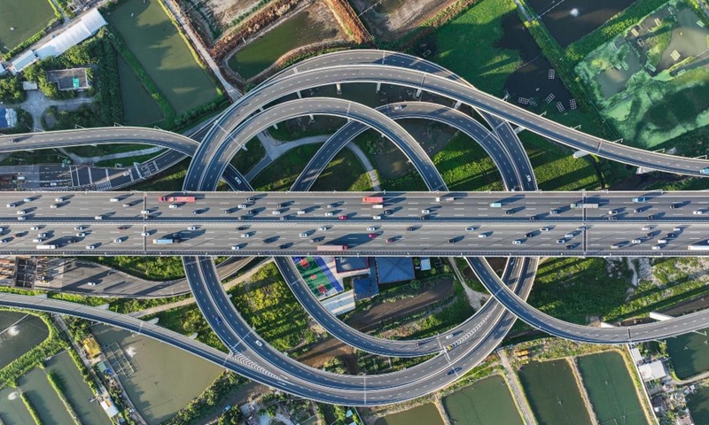 An aerial drone photo taken on Oct. 2, 2024 shows a view of an interchange overpass on the Nansha Bridge, which links Guangzhou City and Dongguan City, in Haiou Island of the Pearl River Estuary area in Guangzhou, south China's Guangdong Province. (Xinhua/Liu Dawei)