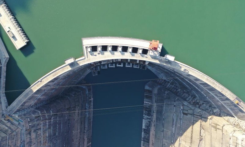 This aerial photo taken on Nov. 24, 2022 shows the Baihetan hydropower station, which straddles the provinces of Yunnan and Sichuan in southwest China. Its operation marked the completion of the world's largest clean energy corridor, where six mega hydropower stations on the Yangtze work to transmit electricity from the resource-rich west to energy-consuming regions in the east. (Xinhua/Xu Bingjie)