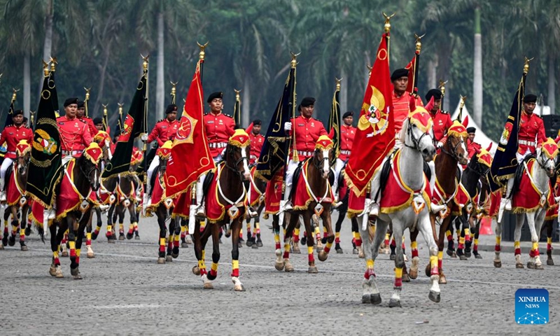 The Indonesian National Army (TNI) participate in a military parade rehearsal of the 79th anniversary of the TNI at Monument National in Jakarta, Indonesia, on Oct. 3, 2024. The TNI will showcase over 1,000 military assets from the Army, Navy, and Air Force during its 79th anniversary celebrations on Oct. 5. (Xinhua/Agung Kuncahya B.)