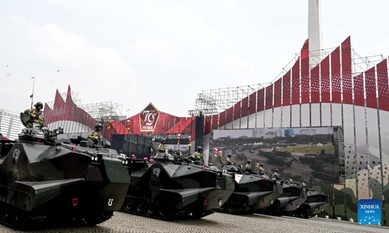 Military vehicles are pictured in a military parade rehearsal of the 79th anniversary of the Indonesian National Army (TNI) at Monument National in Jakarta, Indonesia, on Oct. 3, 2024. The TNI will showcase over 1,000 military assets from the Army, Navy, and Air Force during its 79th anniversary celebrations on Oct. 5. (Xinhua/Agung Kuncahya B.)