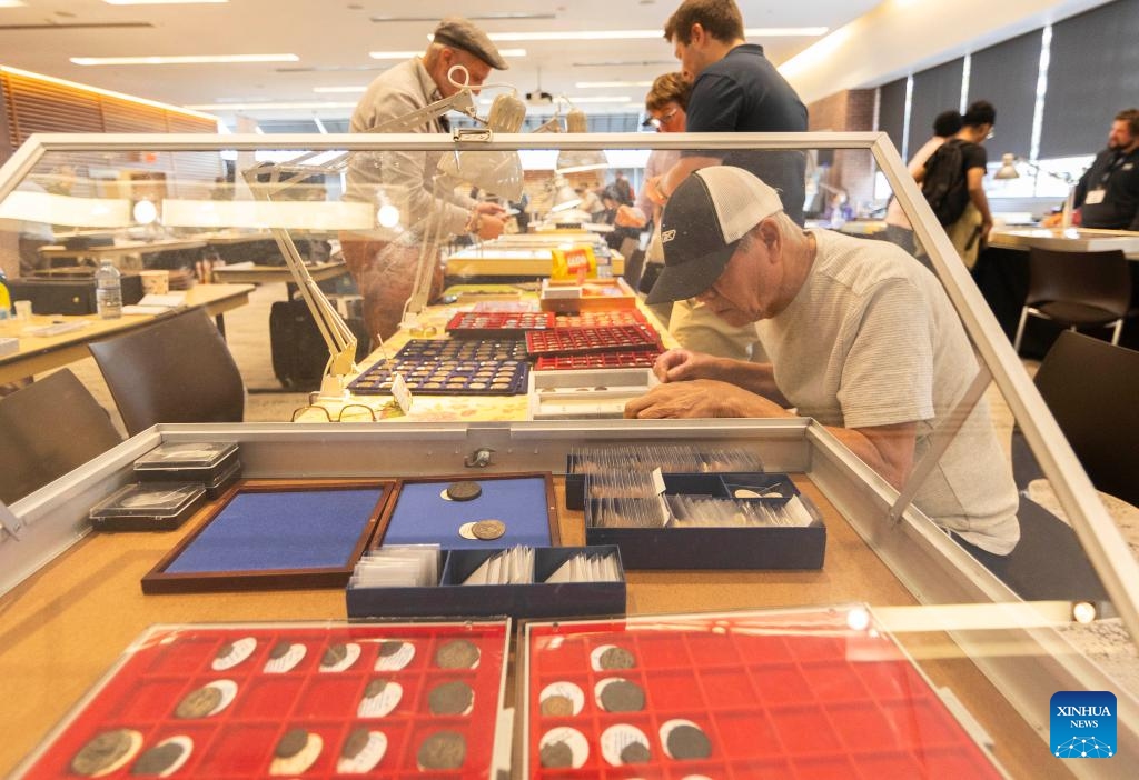 People view collections of coins during the 2024 Toronto Coin Expo in Toronto, Canada, on Oct. 4, 2024. Featuring over 40 coin & banknote dealers, the two-day event kicked off here on Friday. (Photo by Zou Zheng/Xinhua)