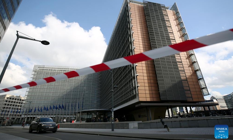 A vehicle passes by the European Commission building in Brussels, Belgium, Oct. 4, 2024. The European Commission announced Friday that it passed a vote to impose punitive tariffs on Chinese battery electric vehicles (EVs), sparking criticism from several European countries and auto industries who warn the move could boomerang against the European Union's (EU) competitiveness. (Xinhua/Zhao Dingzhe)