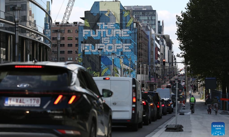 Vehicles wait for traffic light near EU headquarters in Brussels, Belgium, Oct. 4, 2024. The European Commission announced Friday that it passed a vote to impose punitive tariffs on Chinese battery electric vehicles (EVs), sparking criticism from several European countries and auto industries who warn the move could boomerang against the European Union's (EU) competitiveness. (Xinhua/Zhao Dingzhe)