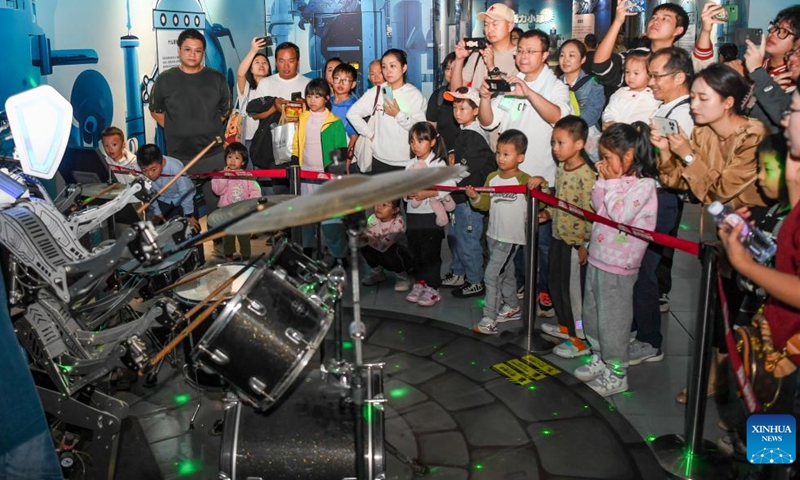 People visit Chongqing Science and Technology Museum in southwest China's Chongqing, Oct. 3, 2024. The National Day holiday, which runs from Oct. 1 to Oct. 7, is a peak travel and tourism season in China. Many children choose to spend their holiday with their parents at Chongqing Science and Technology Museum to learn knowledge and have a touch with the charm of science and technology. (Xinhua/Wang Quanchao)