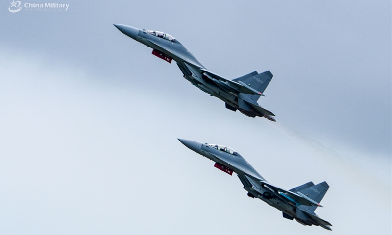 J-16 fighter jets attached to an aviation brigade with the air force under the Chinese PLA Southern Theater Command climb up during a flight training exercise under complex meteorological conditions in early September, 2024. (eng.chinamil.com.cn/Photo by Zhao Yutong)