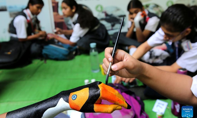 Students participate in a palm painting competition during the Wildlife Week celebration at Van Vihar National Park in Bhopal, the capital city of India's Madhya Pradesh state, Oct. 5, 2024. (Str/Xinhua)