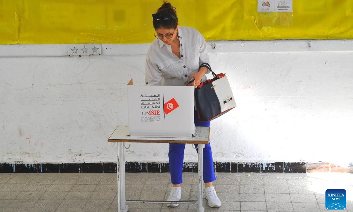 A Tunisian voter fills out a ballot at a polling center in Tunis, Tunisia on Oct. 6, 2024. The polling centers for the Tunisian presidential elections opened on Sunday in 24 provinces of Tunisia, Tunisia's Independent High Authority for Elections said.  (Photo: Xinhua)